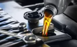 oil being poured into an engine